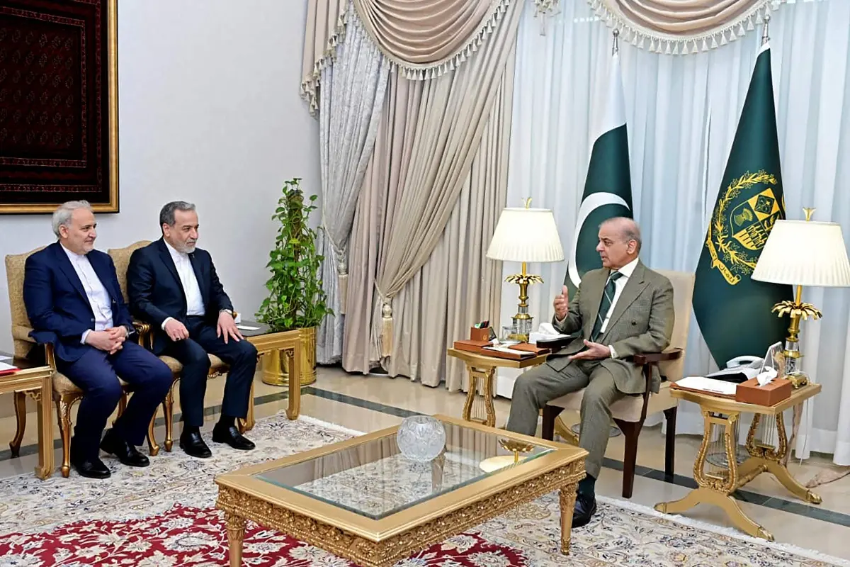 This handout photograph taken on April 25, 2026 and released by Pakistan's Prime Minister Office shows Pakistan's Prime Minister Shehbaz Sharif (R) speaking with Iran's Foreign Minister Abbas Araghchi (C) during their meeting amid the Middle East war, at the Prime Minister House in Islamabad. | Photo via AFP