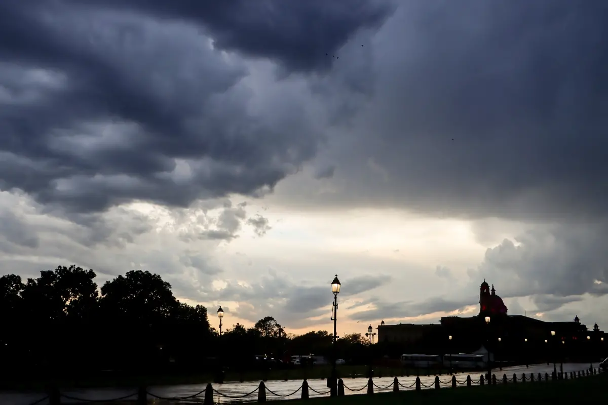 Rain clouds cover the skyline above the Raisina Hill on a rainy evening, in New Delhi.| Photo: PTI