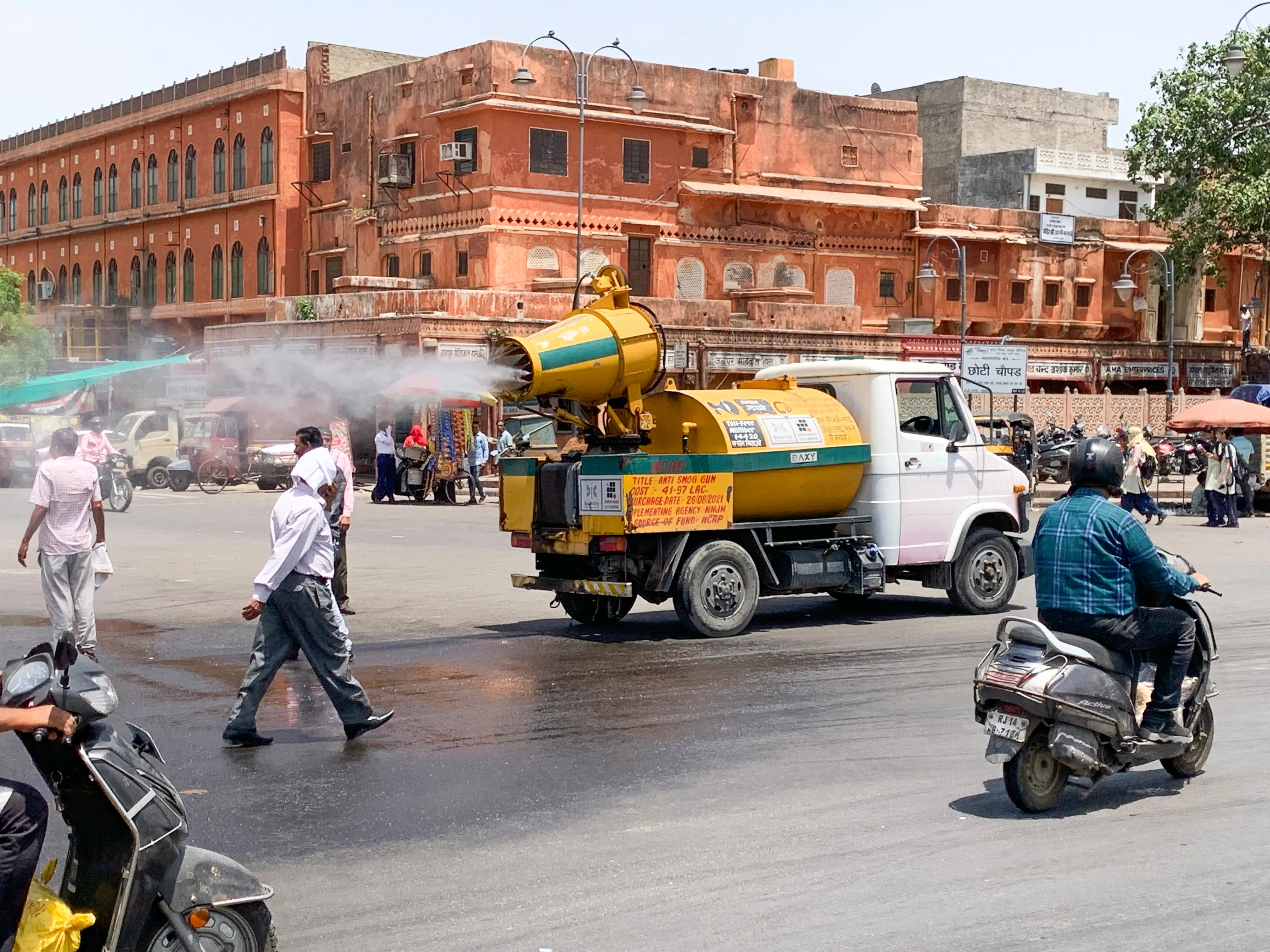 In view of the intense heat, Jaipur Municipal Corporation deploys water-sprinkling vehicles to spray water on roads | ANI