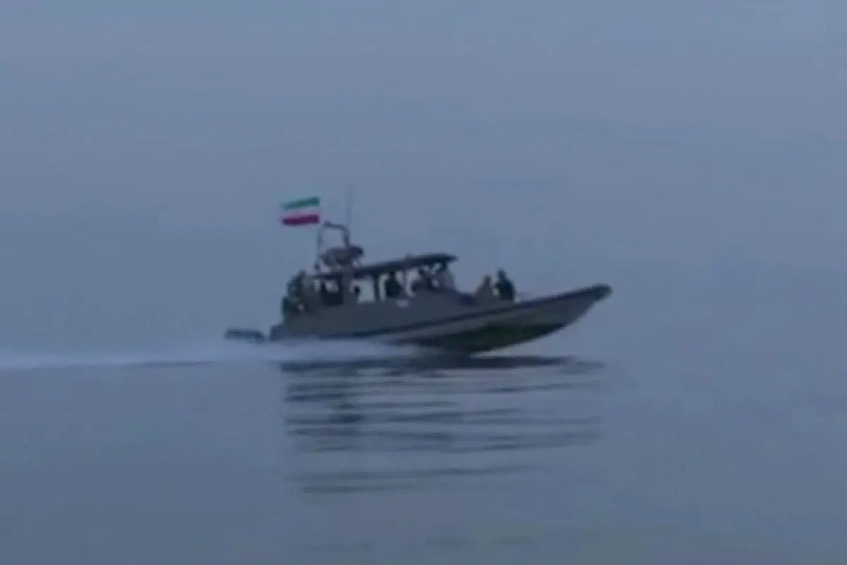 This screen grab taken from undated video footage released by Iran's Revolutionary Guards (IRGC) and made available via Iran's state broadcaster (IRIB) on April 23, 2026, shows an IRGC boat allegedly taking part in an operation to seize ships attempting to cross the Strait of Hormuz. | Photo: AFP