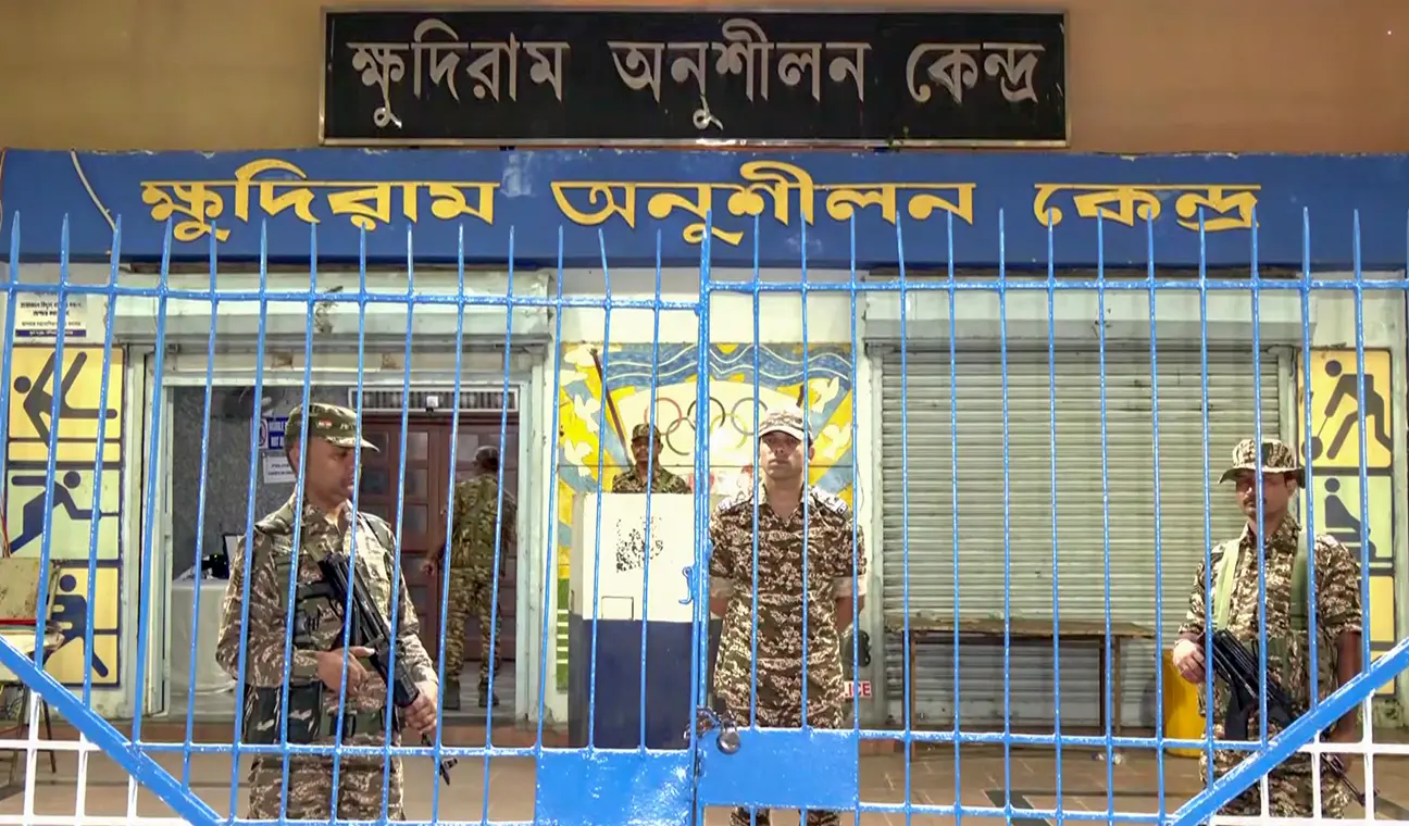Security personnel stand guard outside a strong room in Kolkata | Photo: ANI