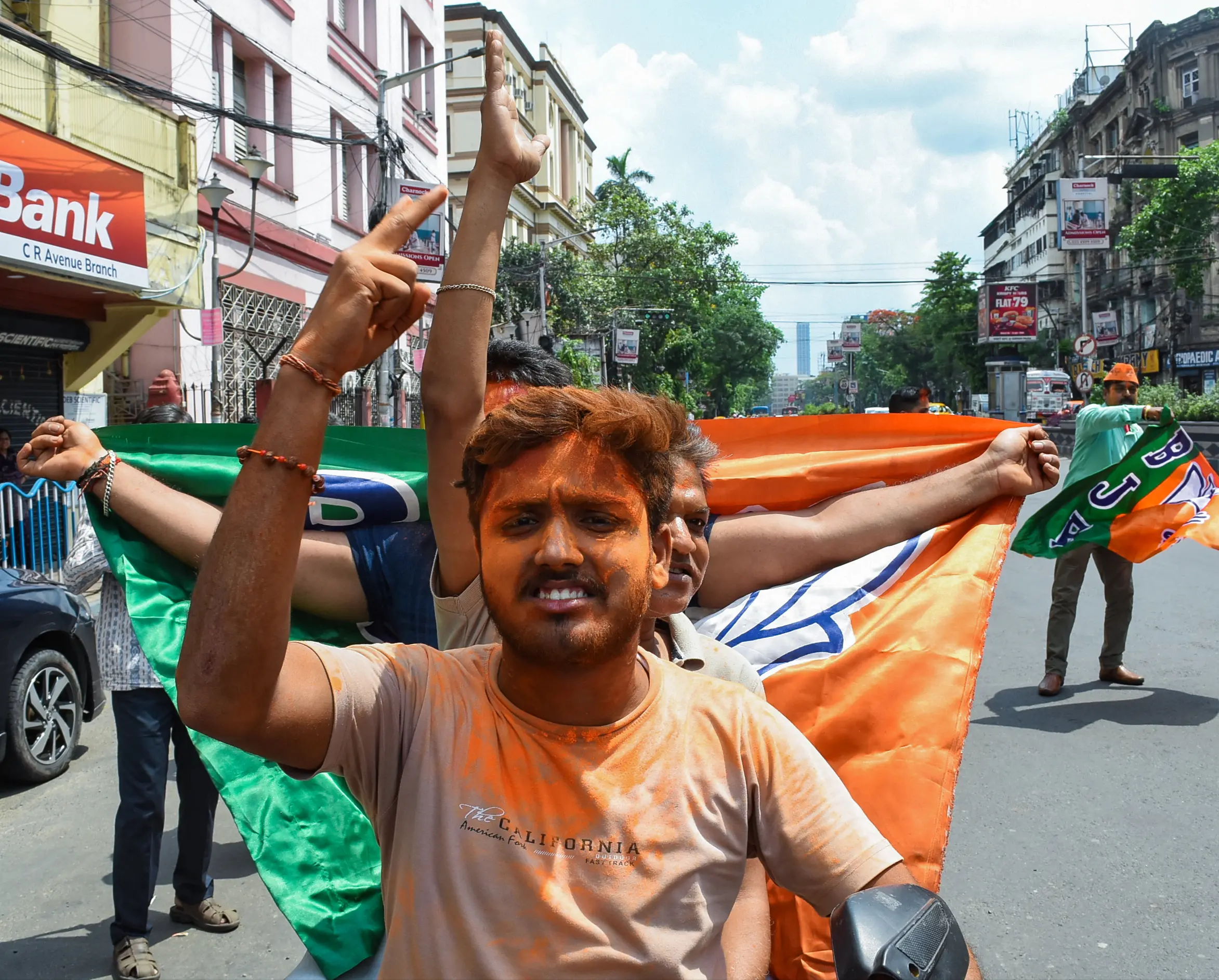 BJP supporters celebrate the party's majority in the West Bengal Assembly elections, in Kolkata on Monday | Photo: ANI