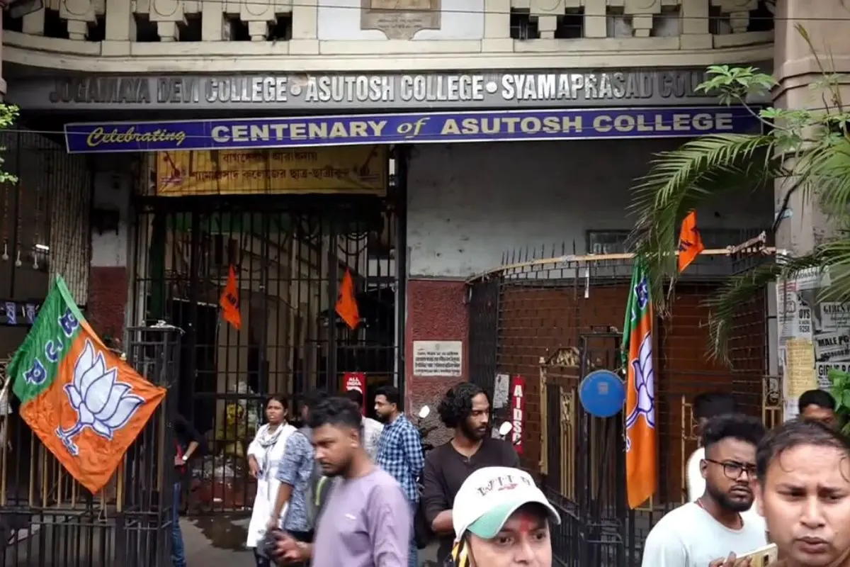 BJP flags seen outside Asutosh College after controversy erupted over saffron tilaks being applied on portraits of Tagore, Vidyasagar, and other icons amid post-poll celebrations.