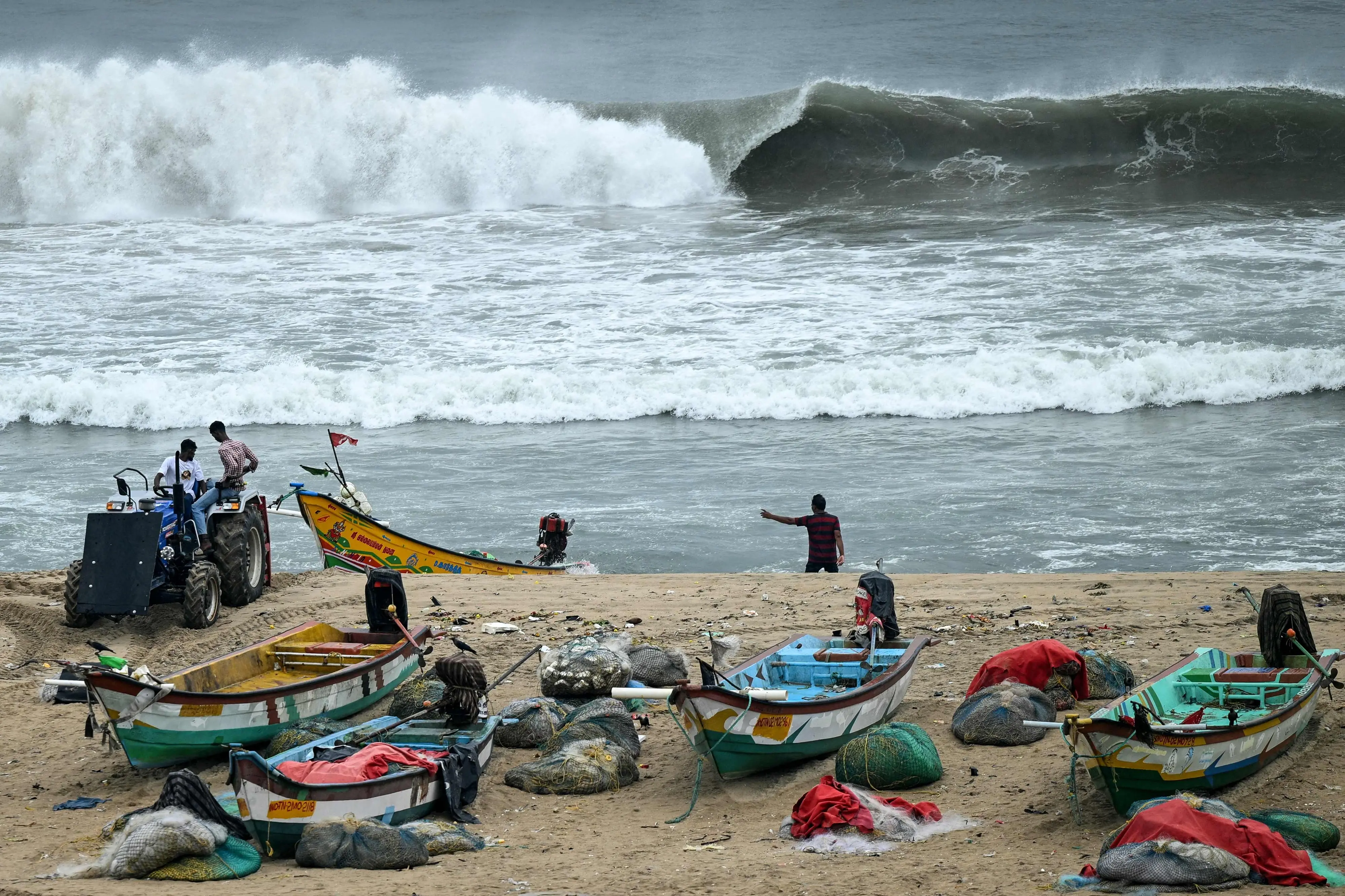 Fishing boats are moored to a safer area at the Marina beach as a preventive measure ahead of Cyclone Montha in Chennai. | Photo: AFP