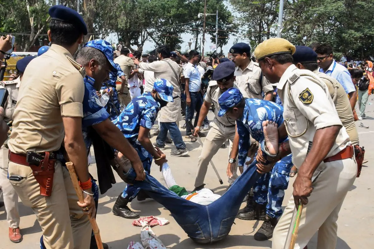 Police try to stop BPSC TRE 4 teacher candidates as they protest over their various demands, in Patna on Friday. (ANI Photo)