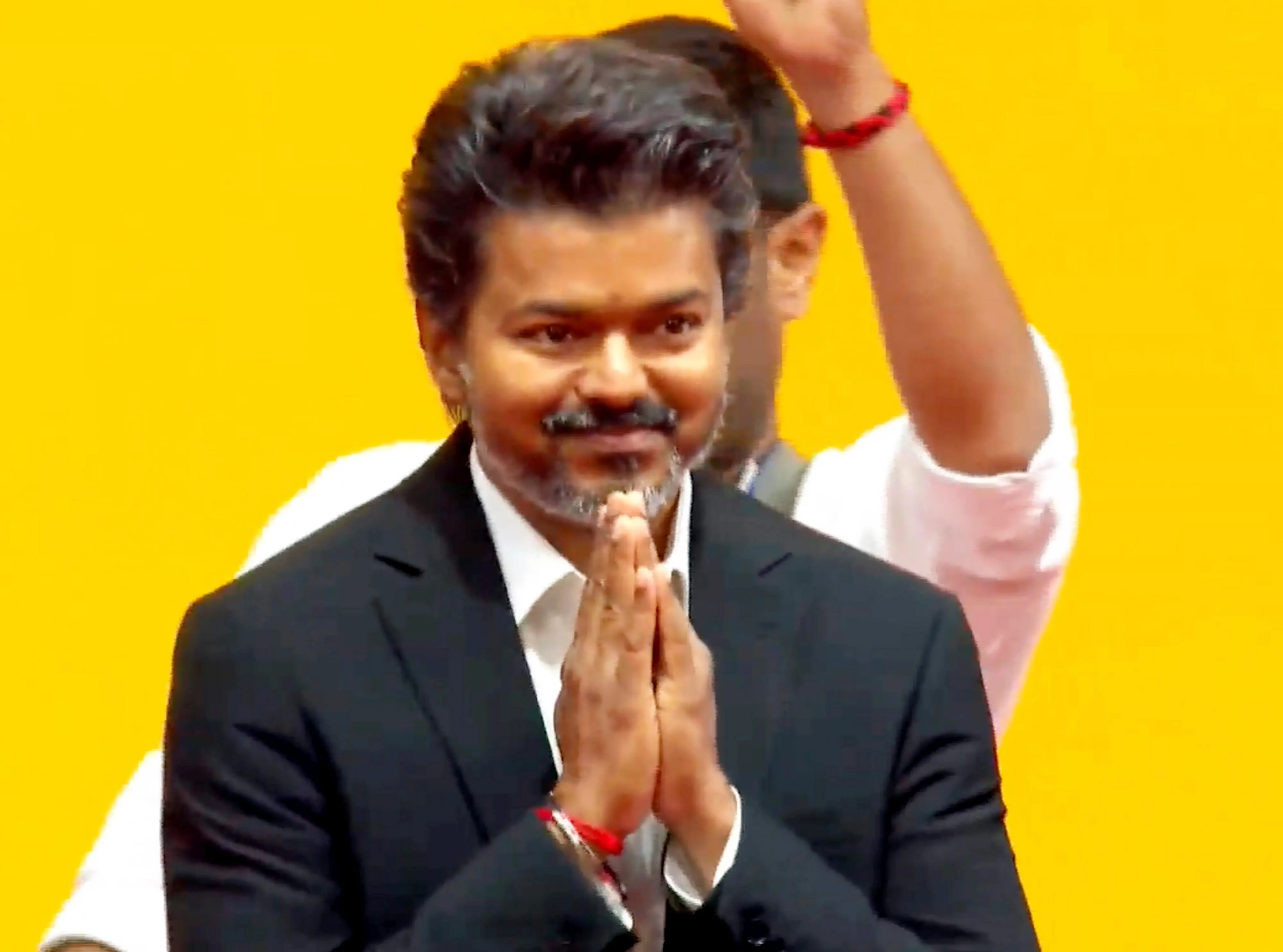 Tamilaga Vettri Kazhagam (TVK) chief C Joseph Vijay greets the gathering during his swearing-in ceremony as the Tamil Nadu Chief Minister | PTI