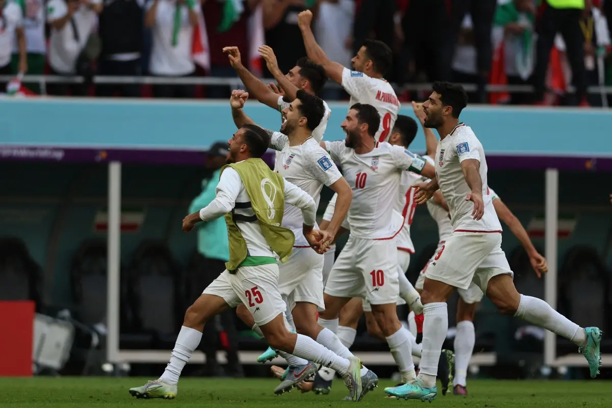 Iran's players celebrate their team's victory during the Qatar 2022 World Cup. | File Photo: AFP
