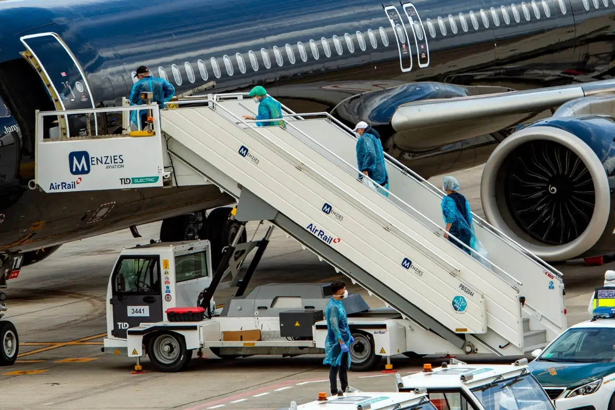 Passengers board a plane bound for the Netherlands at the Tenerife Sur-Reina Sofia airport after being evacuated from the Dutch flagged hantavirus-stricken cruise ship MV Hondius on the island of Tenerife in Spain's Canary Islands | Photo: AFP