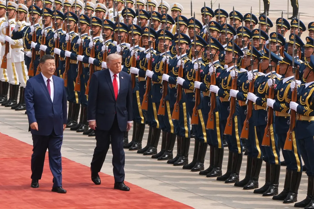 President Donald Trump participates in a welcome ceremony with China's President Xi Jinping at the Great Hall of the People.| Photo: AFP