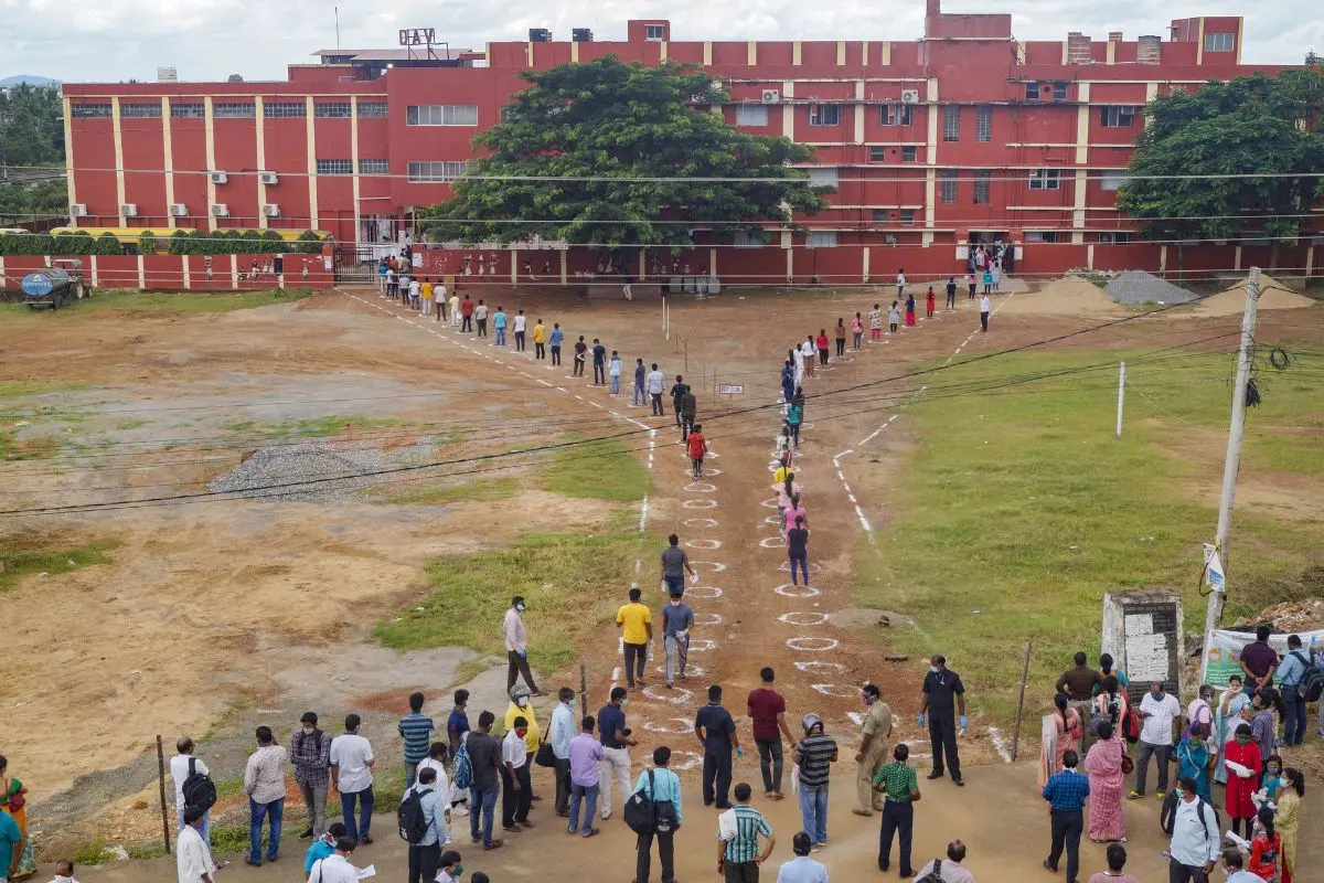 Candidates stand in a queue at an examination centre before appearing in the National Eligibility-cum-Entrance Test (NEET) (File photo: PTI)