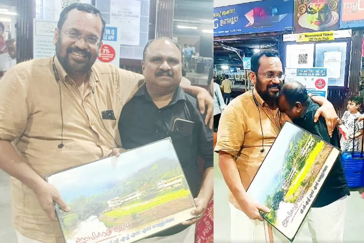 വെള്ളാര്മല സ്കൂളിലെ അധ്യാപകന് ഉണ്ണിക്കൃഷ്ണന് സ്കൂളിന്റെ ചിത്രം മുന് മന്ത്രി കെ. രാജന് ഉപഹാരമായി നല്കിയപ്പോള്.