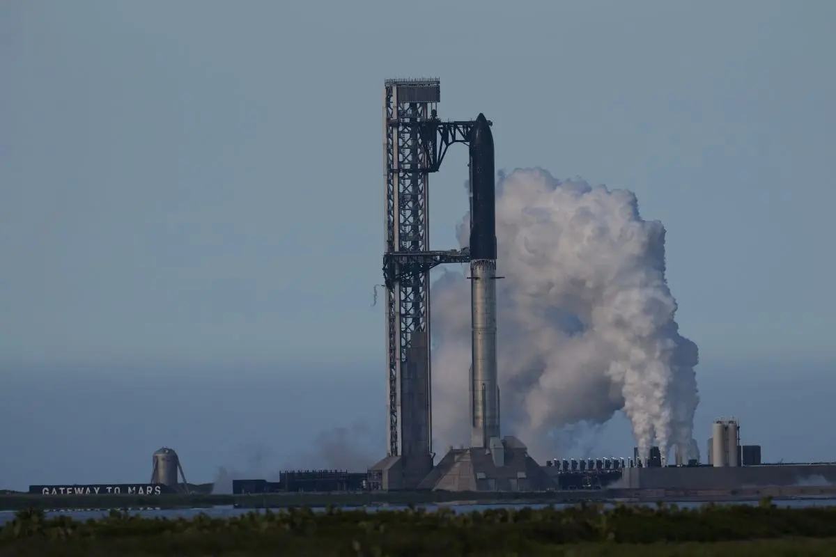 SpaceX's mega rocket Starship is prepared for a test flight that was later delayed, in Starbase, Texas, Thursday, May 21, 2026. (AP Photo/Eric Gay)