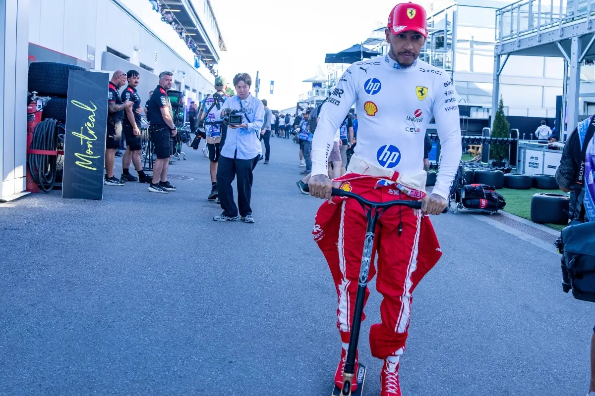 Ferrari driver Lewis Hamilton of Britain, rides a scooter down the paddocks following the sprint qualifying session at the F1 Canadian Grand Prix | Photo: Christinne Muschi/The Canadian P