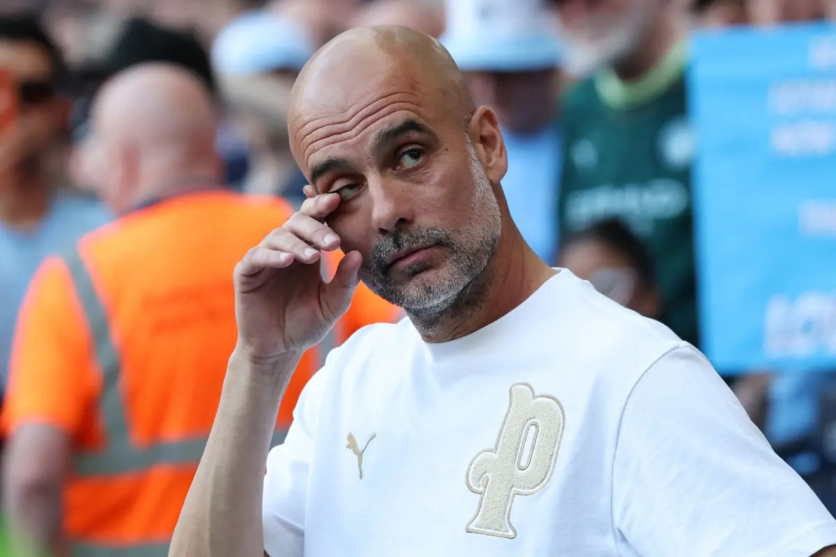 Manchester City's Spanish manager Pep Guardiola reacts as he watches videos of himself during ceremonies to honour those leaving the club at the end of the season | Photo: AFP
