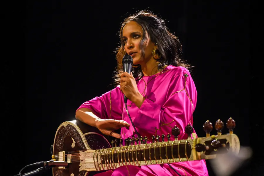 Acclaimed sitar player and composer Anoushka Shankar posing with her musical instrument during an event