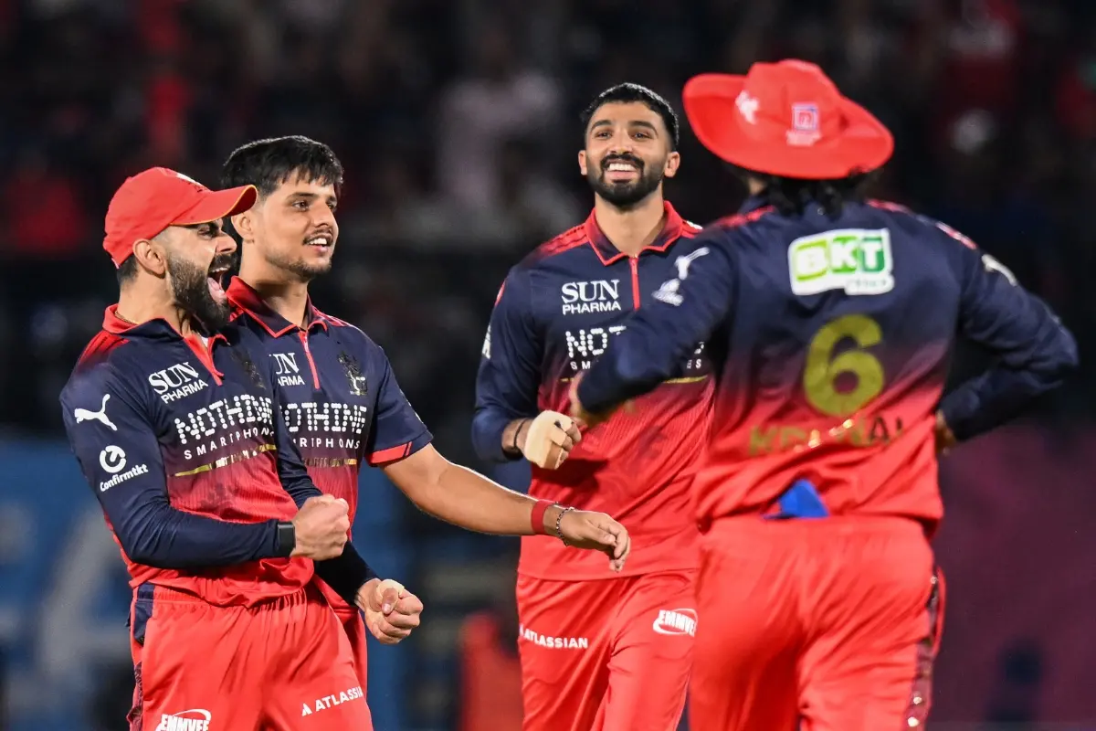 Royal Challengers Bengaluru's Rasikh Salam Dar and teammates celebrate the wicket of Gujarat Titans' Nishant Sindhu during their Indian Premier League 2026 Qualifier 1 | Photo: ANI