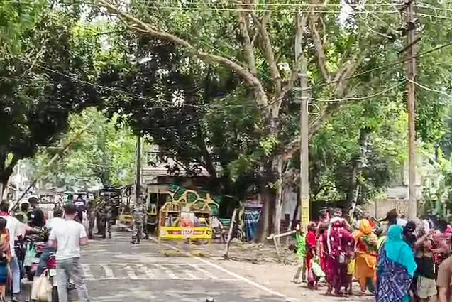 A crowd of illegal immigrants gathers at the Hakimpur Check Post as they intend to return to Bangladesh