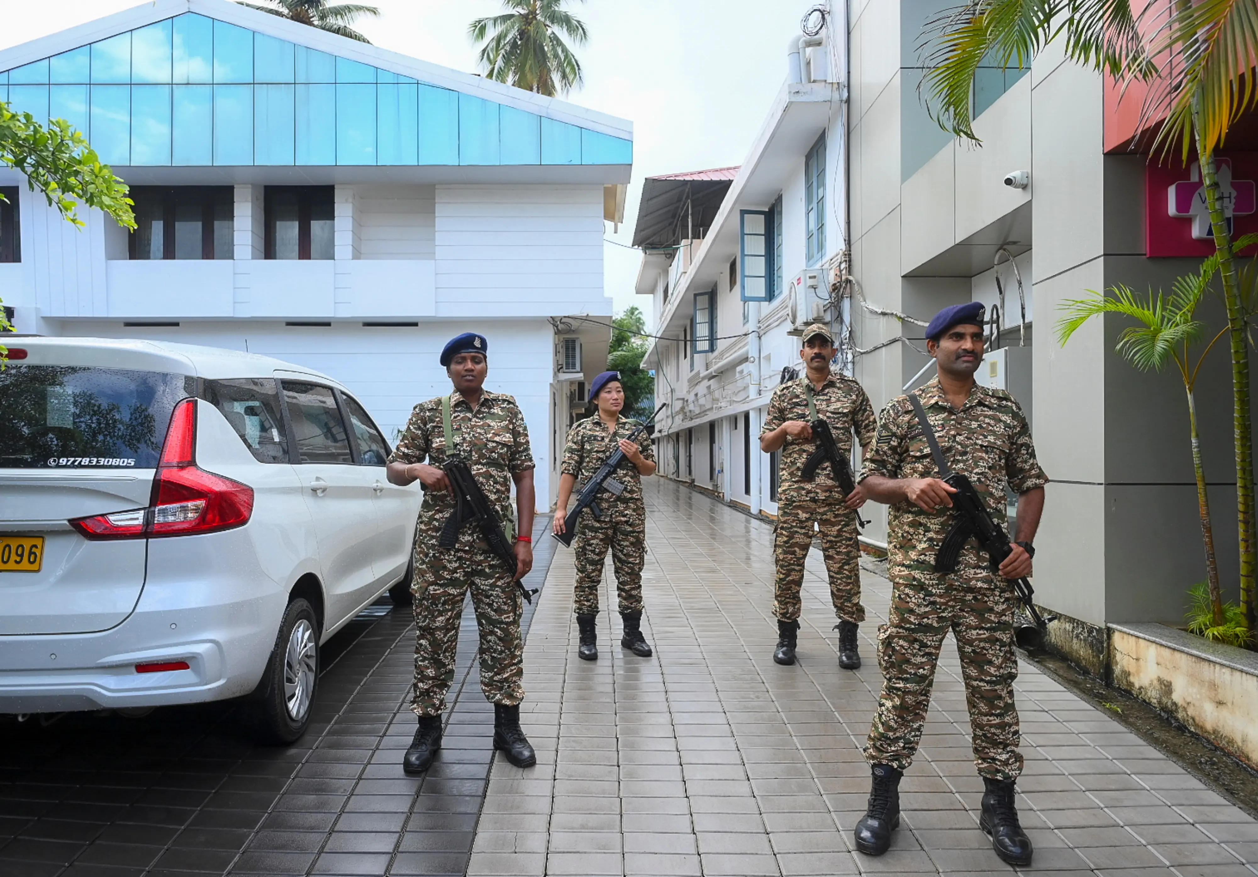 Security personnel stand guard outside the residence of former Kerala Chief Minister Pinarayi Vijayan after the Enforcement Directorate (ED) conducted a raid at Vijayan's residence as part of its investigation against his daughter in the CMRL money laundering case, in Thiruvananthapuram, on Wednesday, May 27, 2026. | Photo: PTI