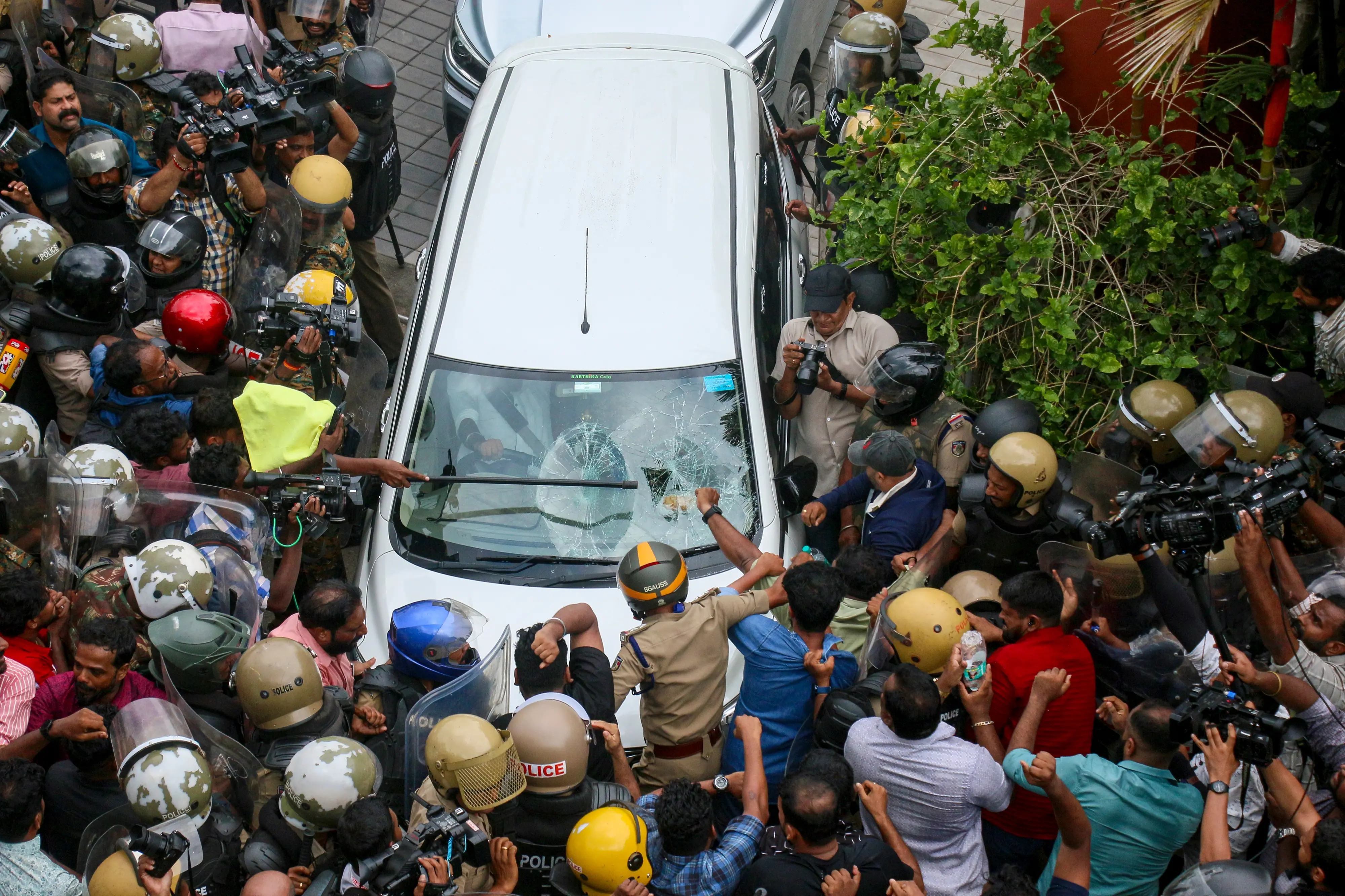 Left Democratic Front (LDF) activists attack the vehicle carrying Enforcement Directorate (ED) officials outside former Kerala CM Pinarayi Vijayan's residence | PTI