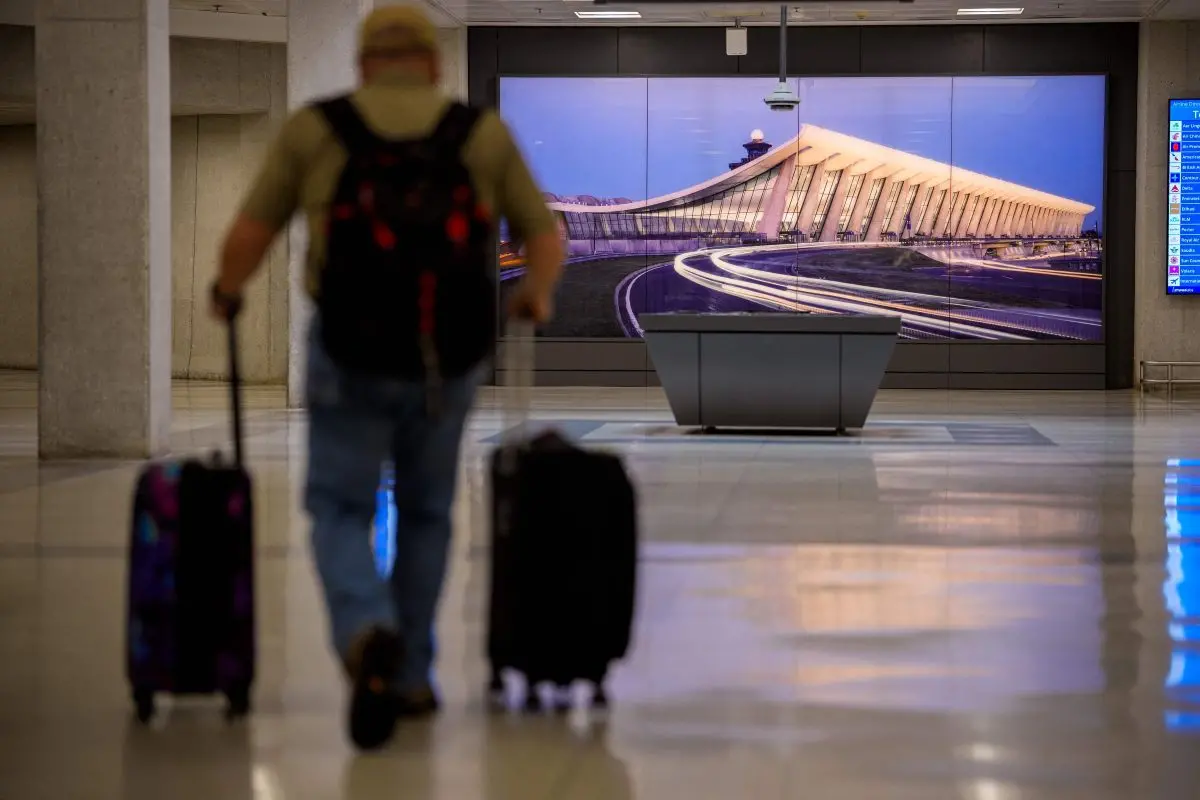 An image of Washington Dulles International Airport is displayed in one of the airport's tunnels on May 22, 2026 in Dulles, Virginia. | Representational Image via AFP