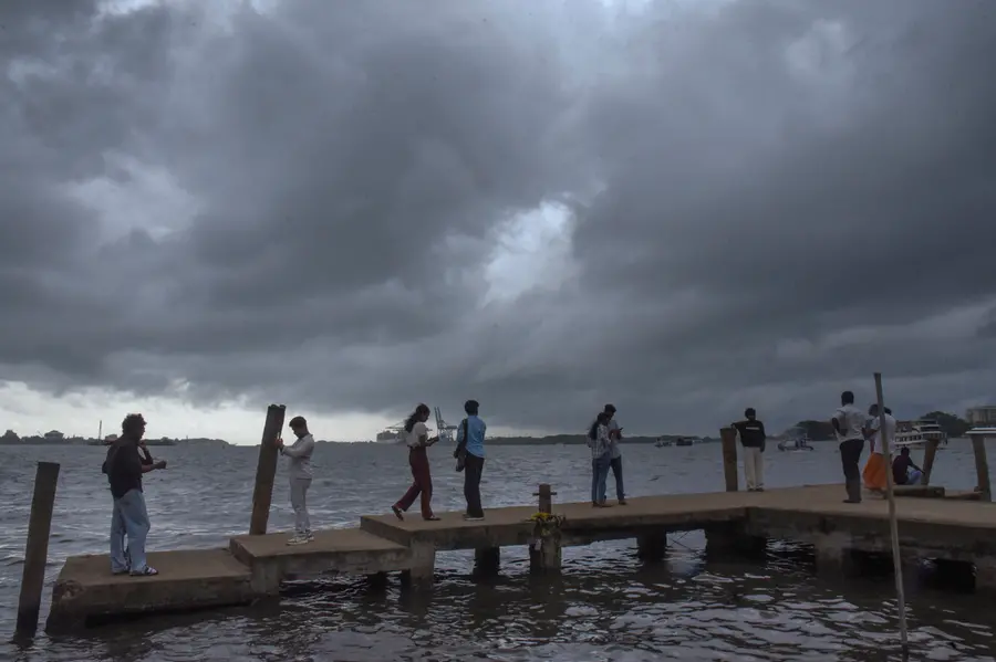 Visitors at the Marine Drive on a rainy afternoon in Kochi