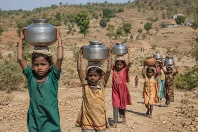 Children carry water pots instead of school bags in Madhya Pradesh village