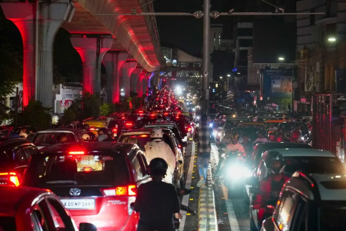 Heavy traffic congestion grips a Bengaluru roadway as thousands of RCB supporters take to the streets following the franchise's IPL title victory.