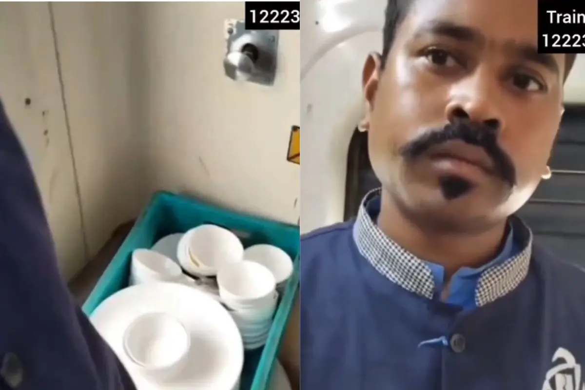 Catering staff washing utensils inside a train toilet