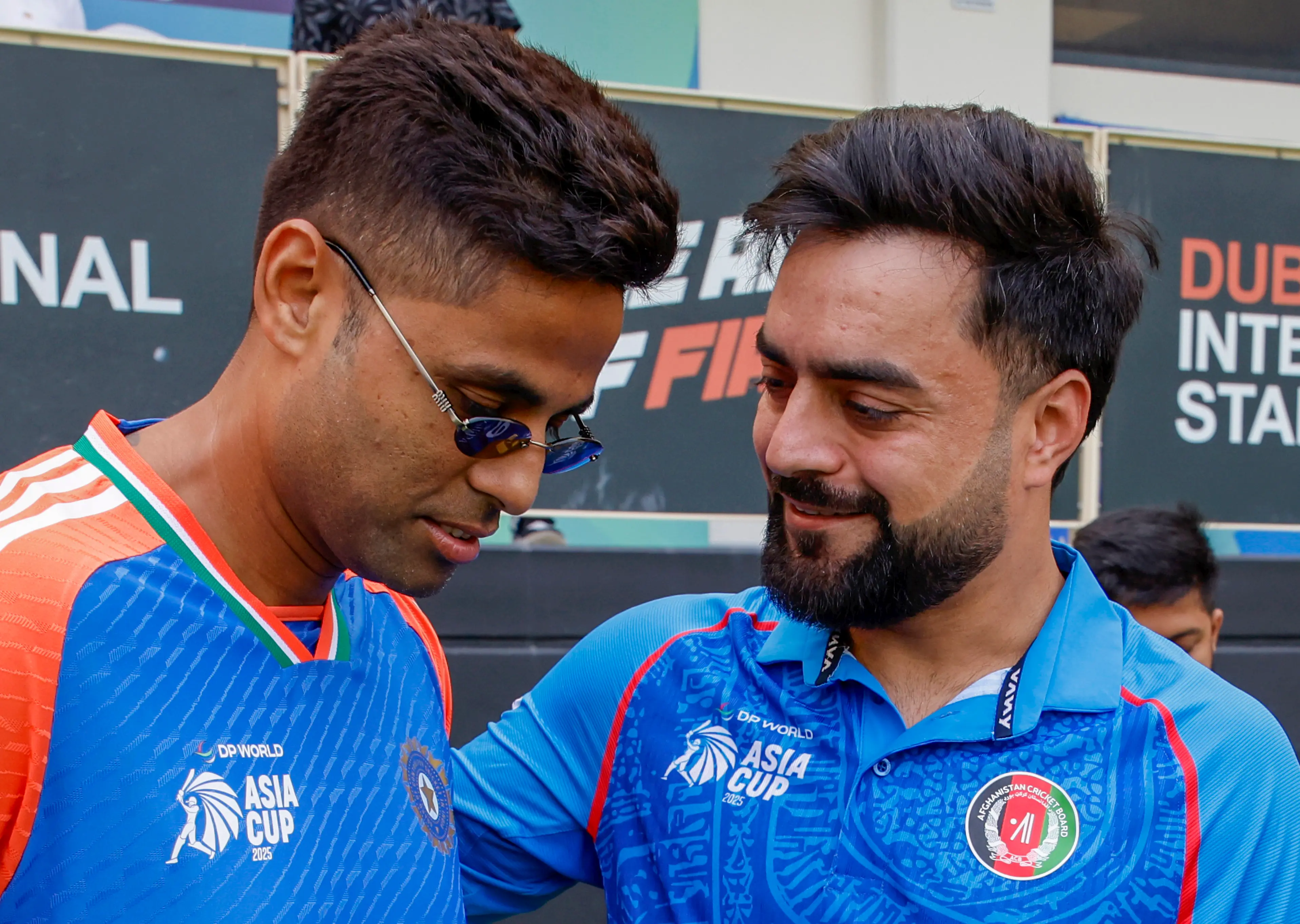സൂര്യകുമാർ യാദവും റാഷിദ് ഖാനും | Creimas/Asian Cricket Council via PTI