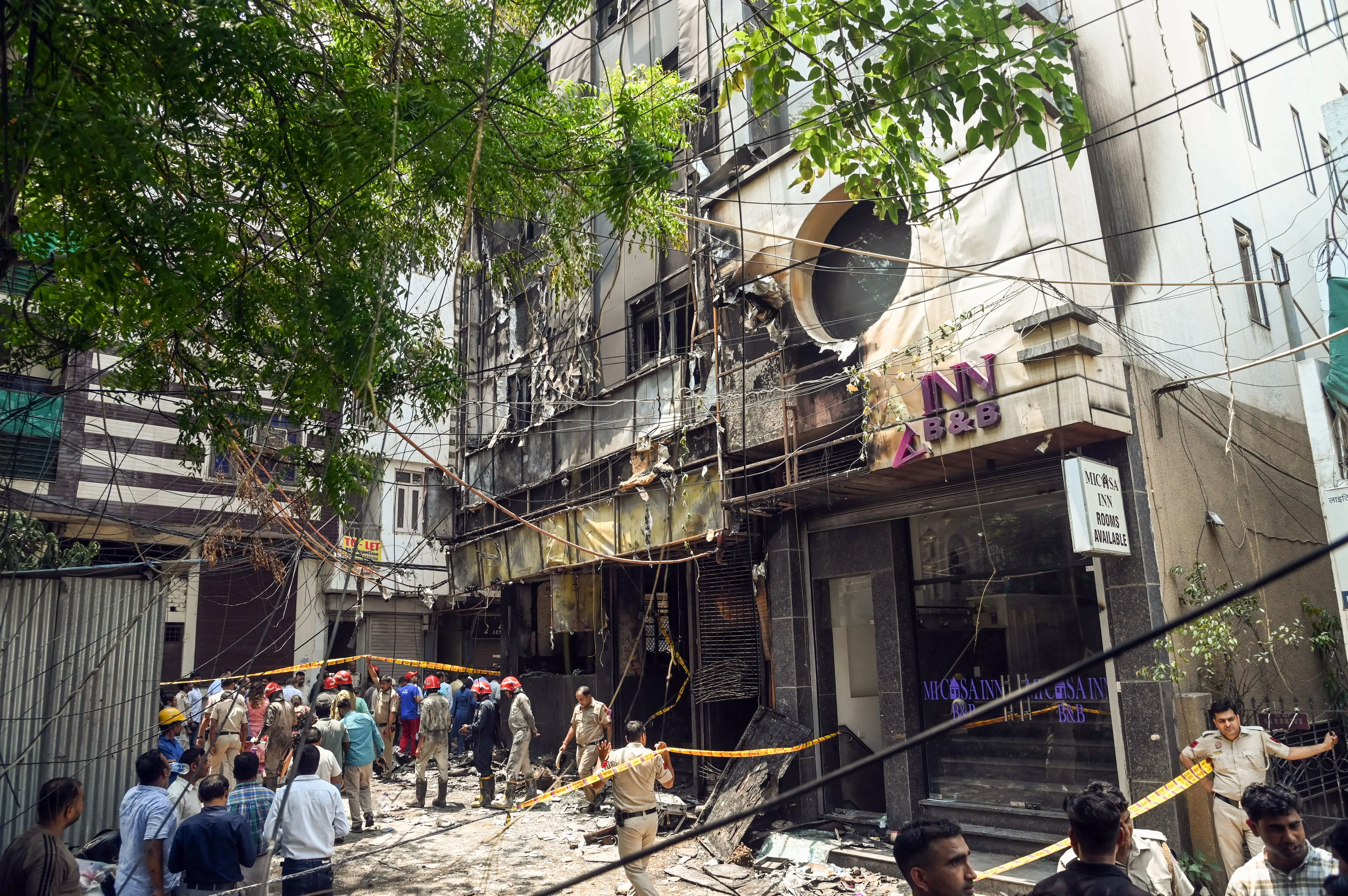 Media personnel at the site where a fire broke out in a restaurant at Malviya Nagar, in New Delhi on Wednesday | ANI