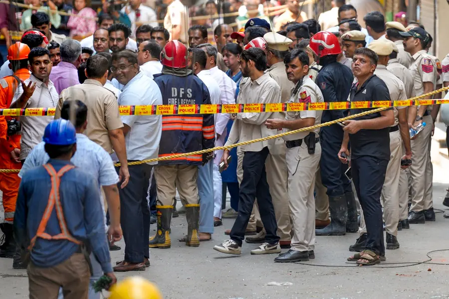 Police cordon off the area after a fire broke out at a bed-and-breakfast in a five-storey building in south Delhi's Malviya Nagar area
