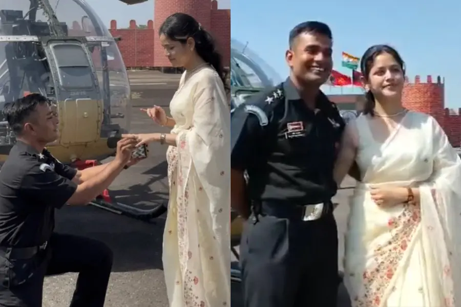 An Indian Army Captain in ceremonial uniform proposing to his partner on a tarmac with a military helicopter in the background