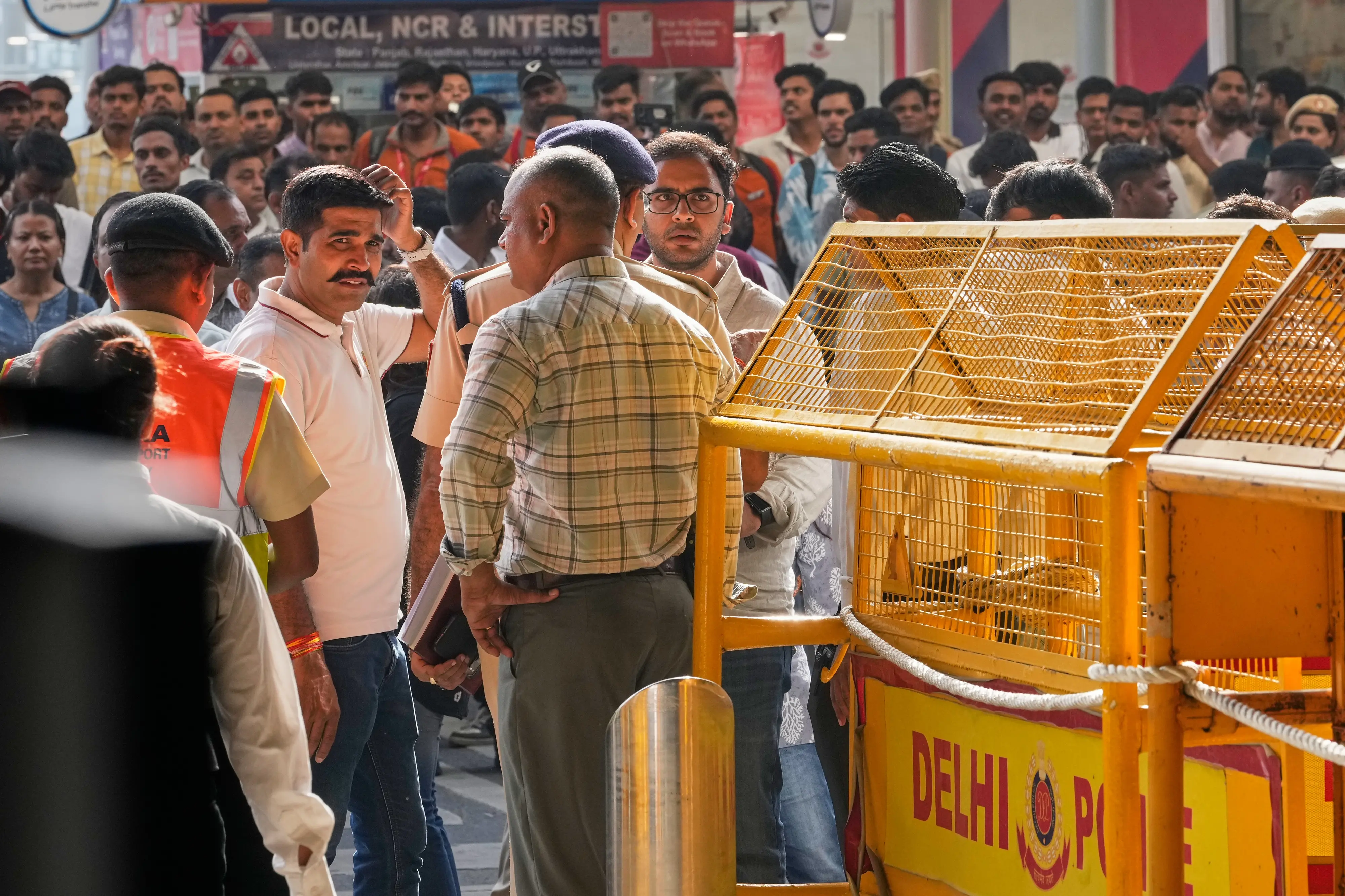 Saurabh Das, centre, spokesperson of Cockroach Janta Party waits for the arrival of Abhijeet Dipke, founder of CJP at Indira Gandhi International airport in New Delhi | AP