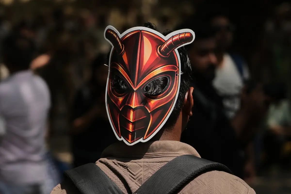 A participant wears a cockroach mask as supporters of the Cockroach Janta Party gather for a protest demonstration in New Delhi.| Photo: AP