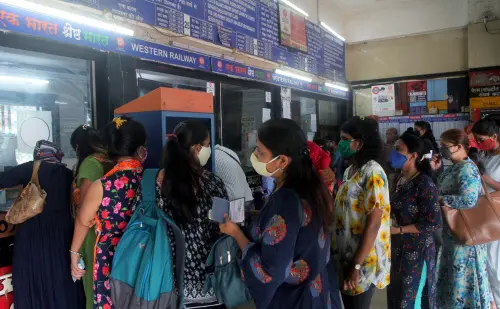 A queue of passengers at a railway station counter to get train tickets | Photo: ANI