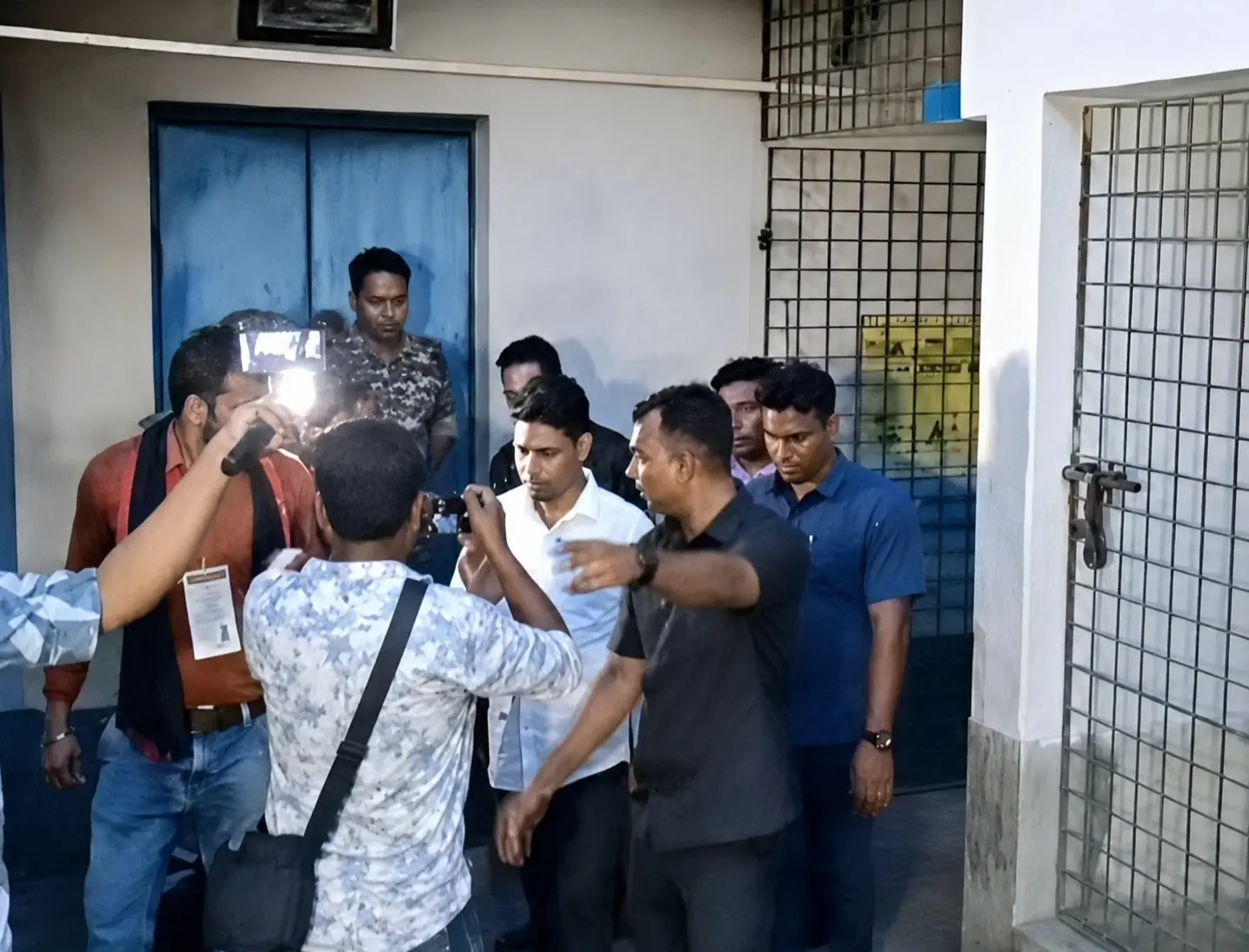 TMC leader Jahangir Khan being escorted by police personnel after being arrested near the India-Nepal border in connection with an extortion case, ending days of evasion from investigators. (Screengrab: X video)