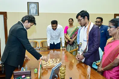 Tamil Nadu CM Vijay loses chess game to Praggnanandhaa, honours him with ₹50 lakh reward