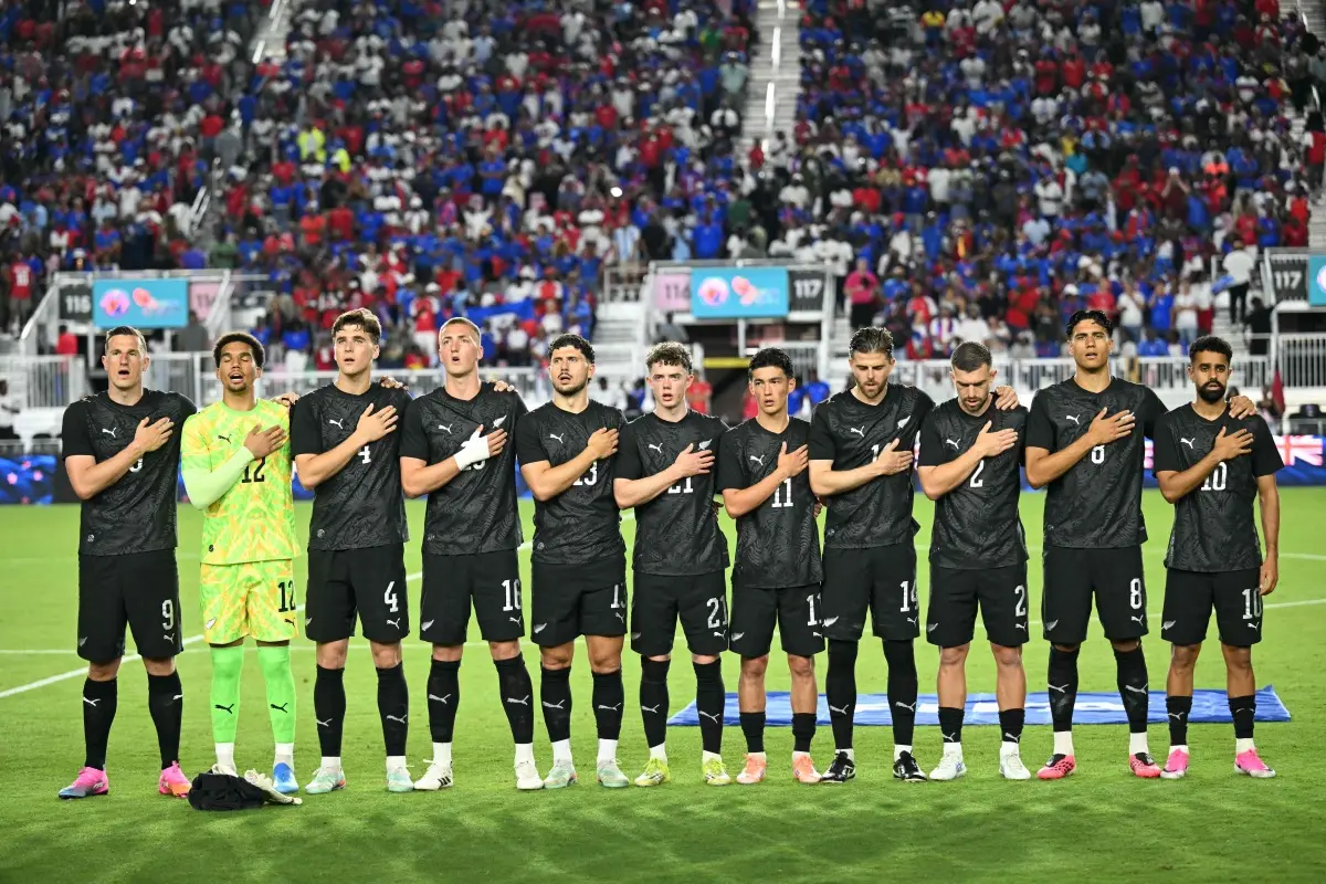 The New Zealand national team stands for their national anthem before an international friendly football match between Haiti and New Zealand at Chase Stadium in Fort Lauderdale, Florida. | Photo: AFP