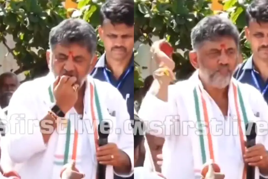 Karnataka CM DK Shivakumar biting an apple and tossing apples into a crowd