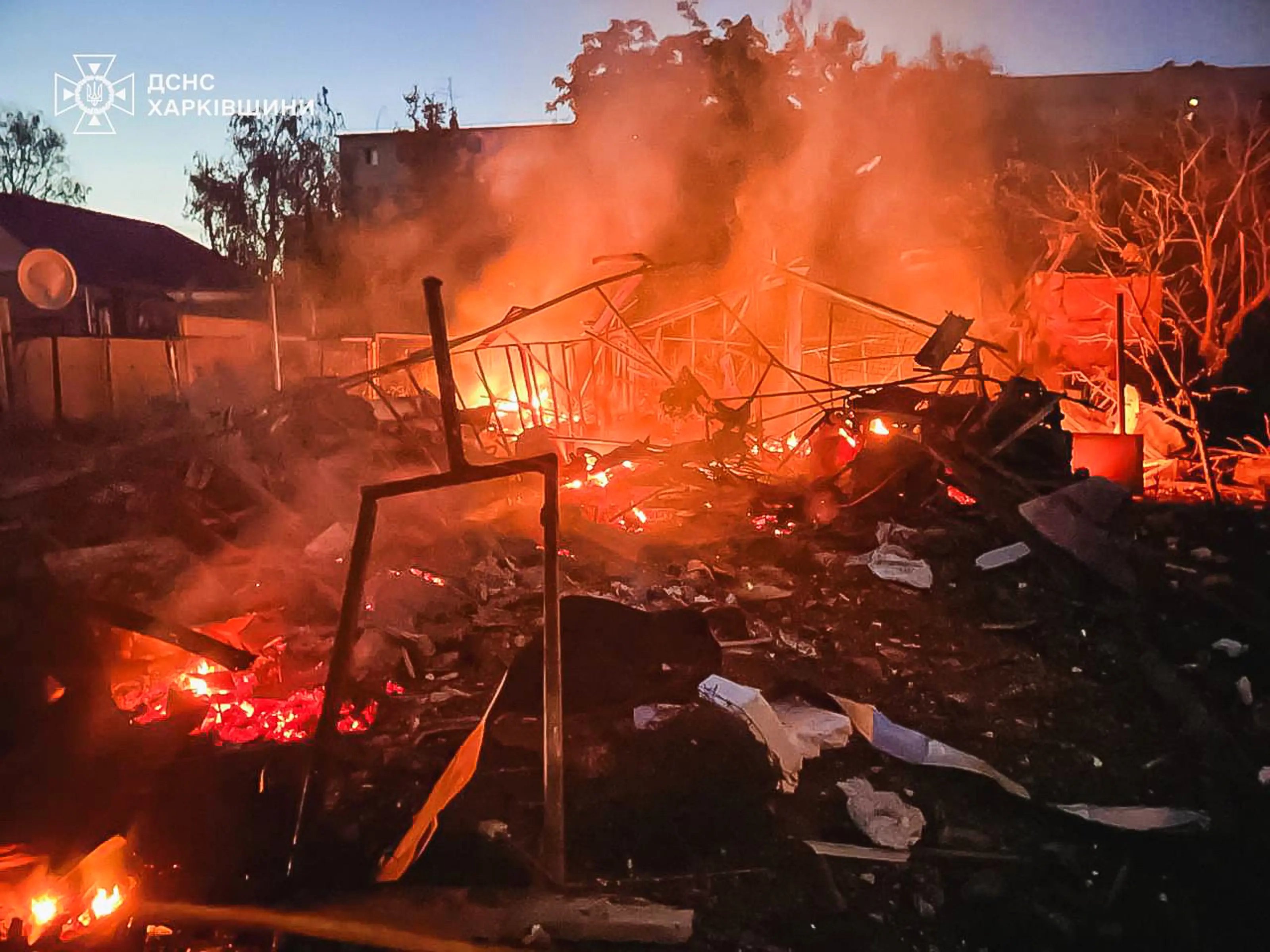 A damaged building burns after a Russian strike in Kharkiv, Ukraine | AP