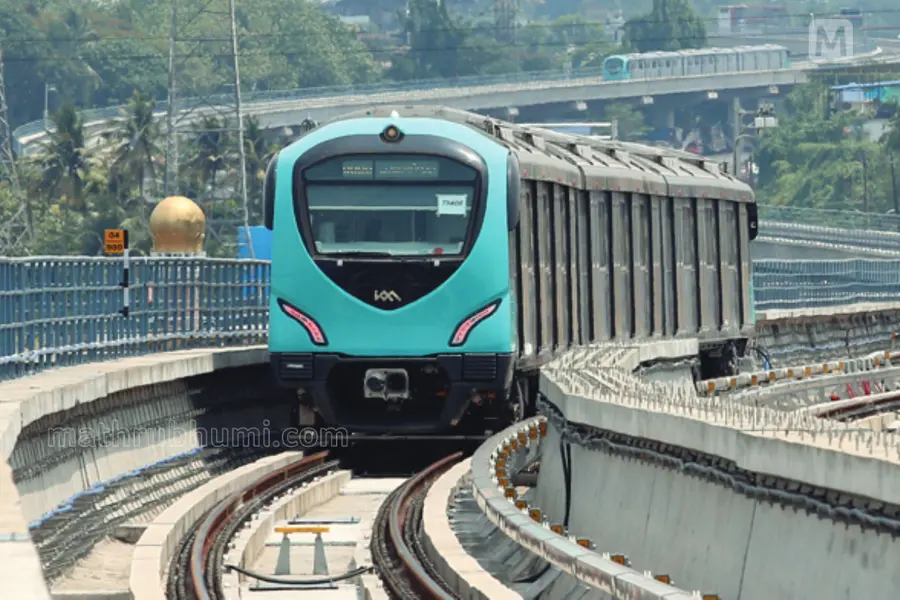 A Kochi Metro train arriving at a busy station, reflecting the increasing passenger demand in the city