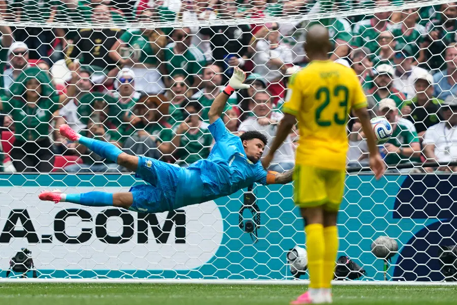 South Africa goalkeeper Ronwen Williams makes a save during the World Cup Group A soccer match between Mexico and South Africa