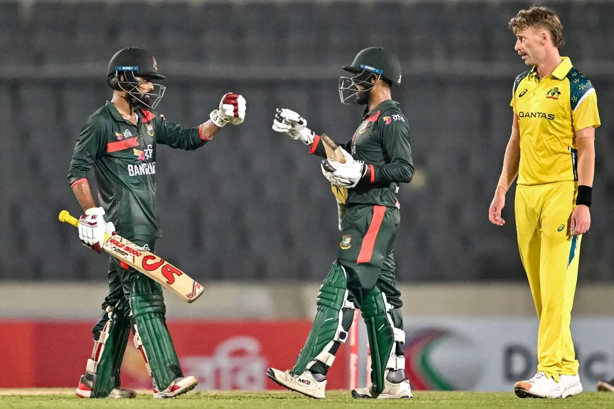 Bangladesh's Towhid Hridoy (L) and captain Mehidy Hasan Miraz (C) celebrate their team's win at the end of the second one-day international (ODI) cricket match between Bangladesh and Australia at the Sher-e-Bangla National Stadium in Dhaka. | Photo: AFP