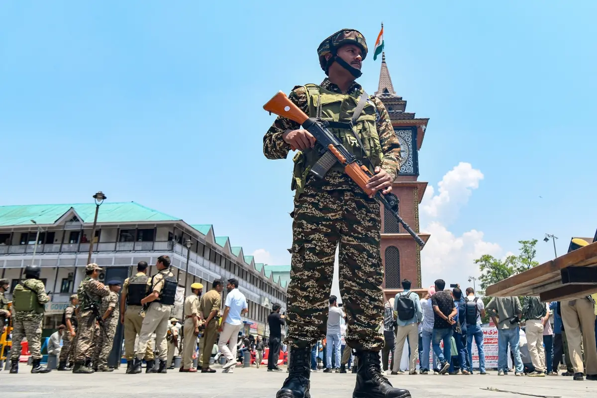A CRPF personnel stand guard as the Association of Terror Victims Kashmir (ATVK) stages a protest at Lal Chowk, demanding justice for civilians killed in Pakistan-occupied Jammu and Kashmir (PoJK), in Srinagar.| Photo: ANI
