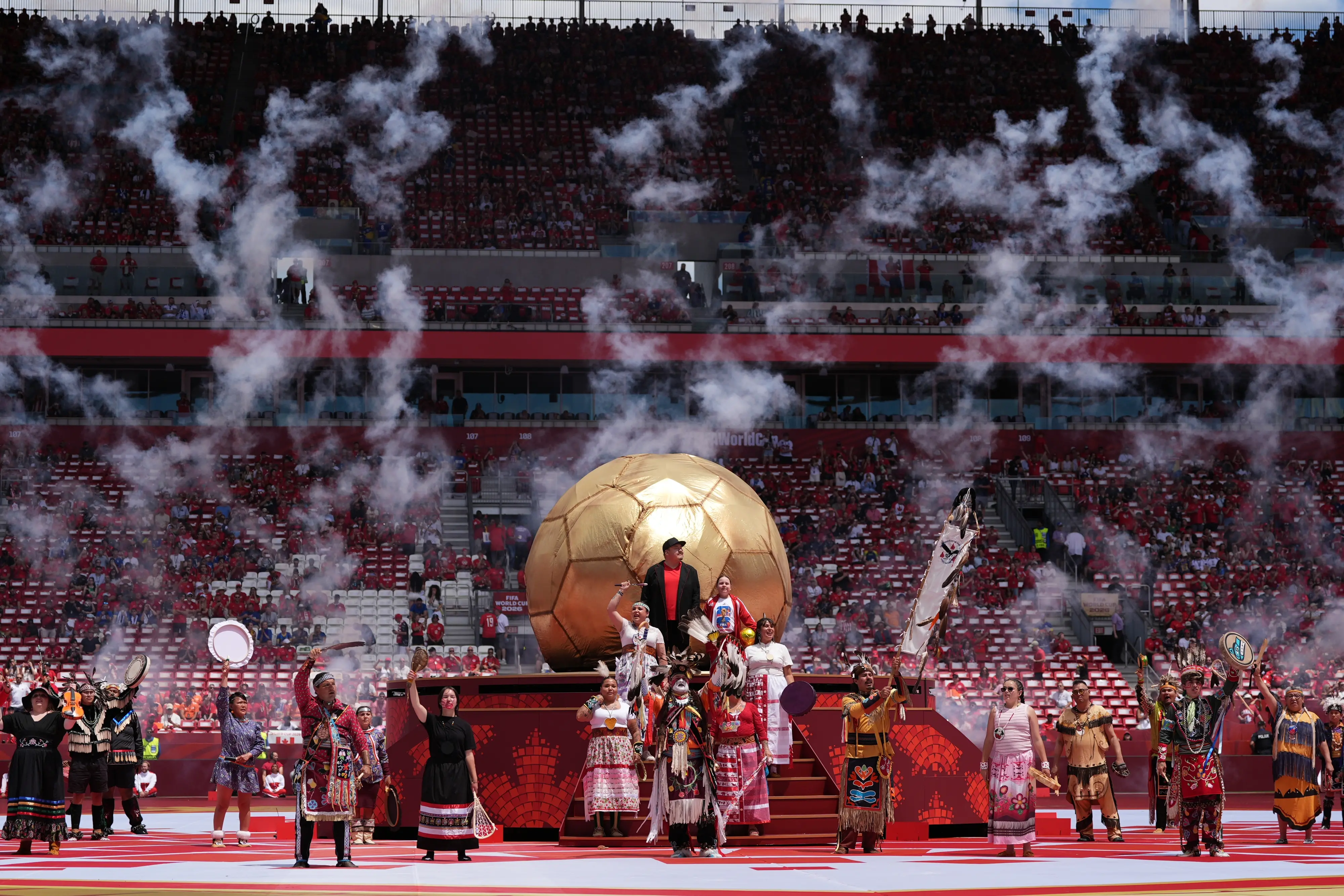 First Nation people perform during the opening ceremony for the World Cup Group B soccer match between Canada and Bosnia in Toronto | AP