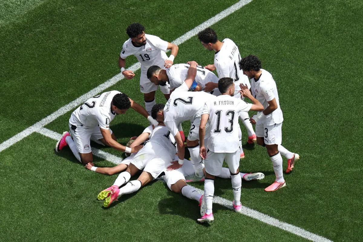 Emam Ashour #8 of Egypt celebrates with teammates after scoring the team's first goal during the FIFA World Cup 2026 Group G match between Belgium and Egypt | Photo: Getty Images via AFP
