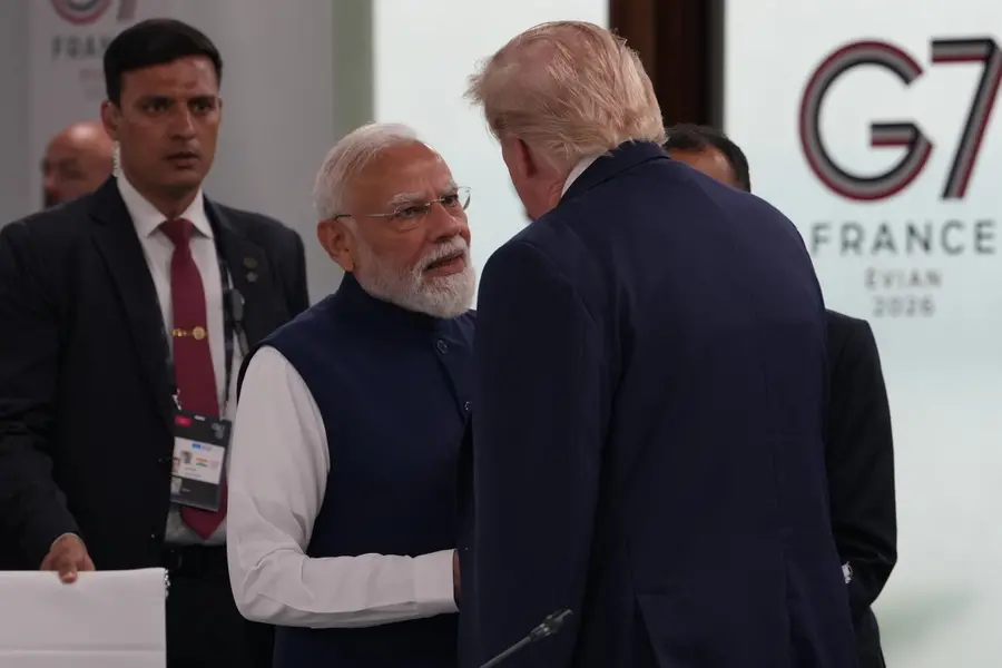 India's Prime Minister Narenda Modi shakes hands with U.S. President Donald Trump