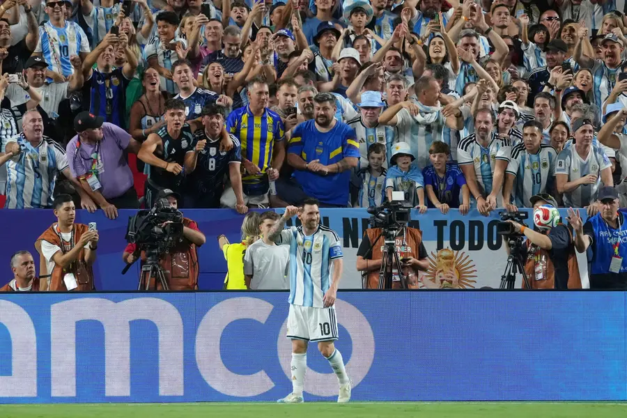 Messi celebrates after scoring his second goal during the World Cup Group J soccer match between Argentina and Algeria in Kansas City