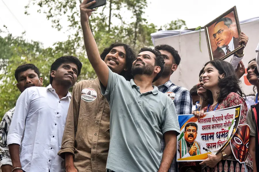Cockroach Janata Party (CJP) founder Abhijeet Dipke clicks a group selfie during a demonstration over the NEET-UG paper leak row and various issues at Samvidhan Chowk, in Nagpur | ANI