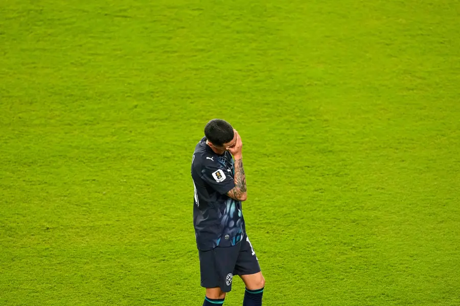 Paraguay's Miguel Almiron reacts after he received a red card